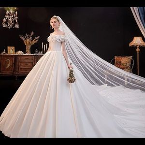 New off-shoulder wedding dress, still in package